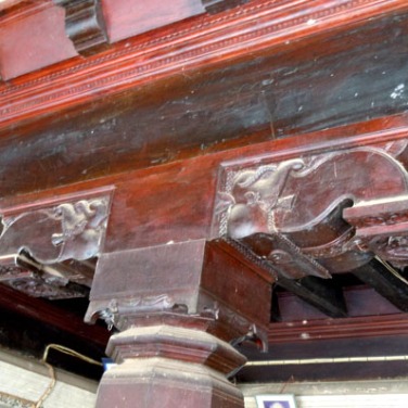 Detail of carving on one of the the solid wood pillars in the hall